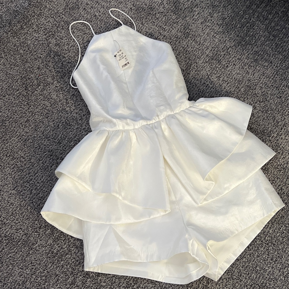 Ivory peplum romper!